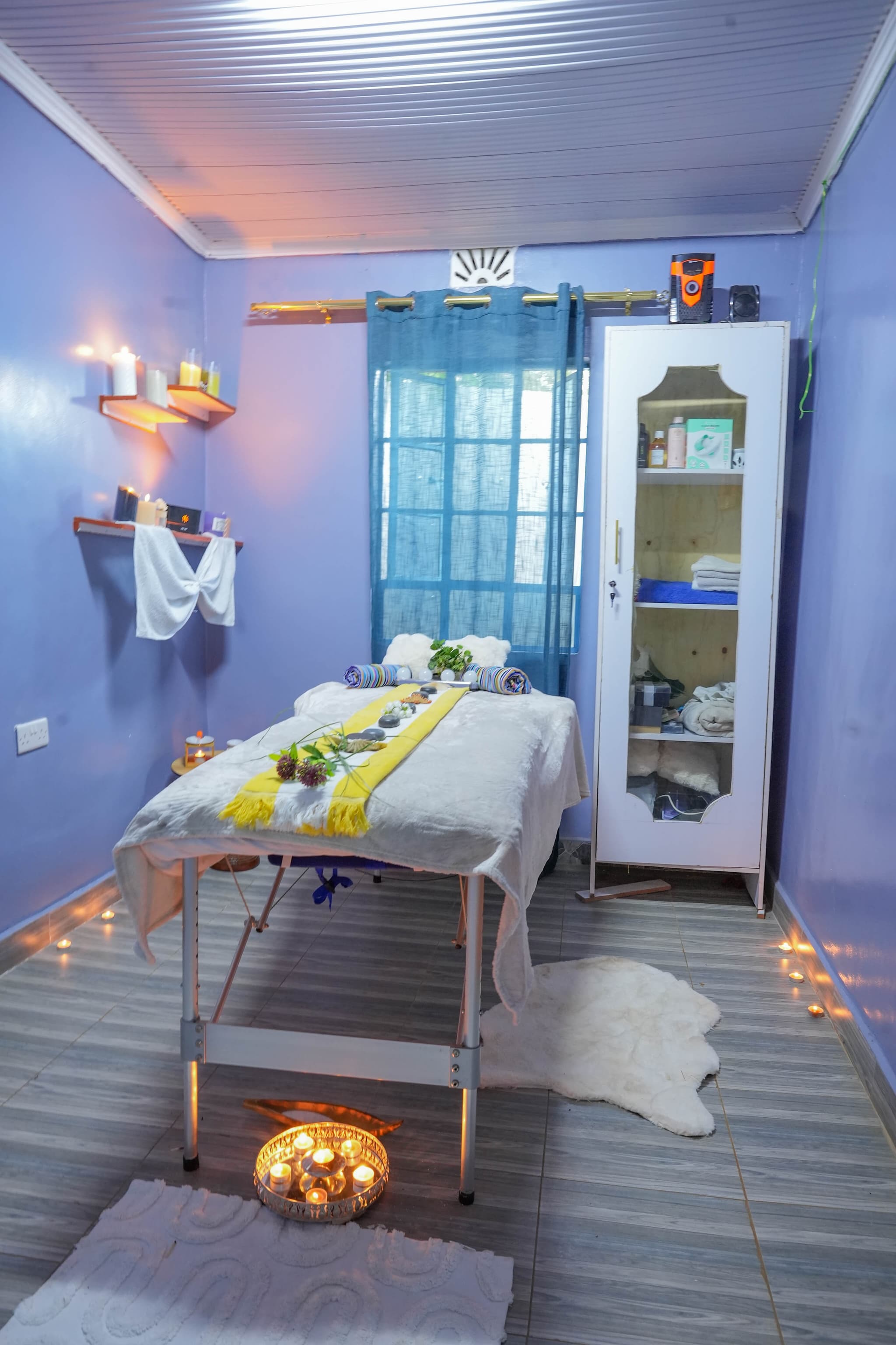 Serene wooden sauna room with warm glow, rolled towels and eucalyptus